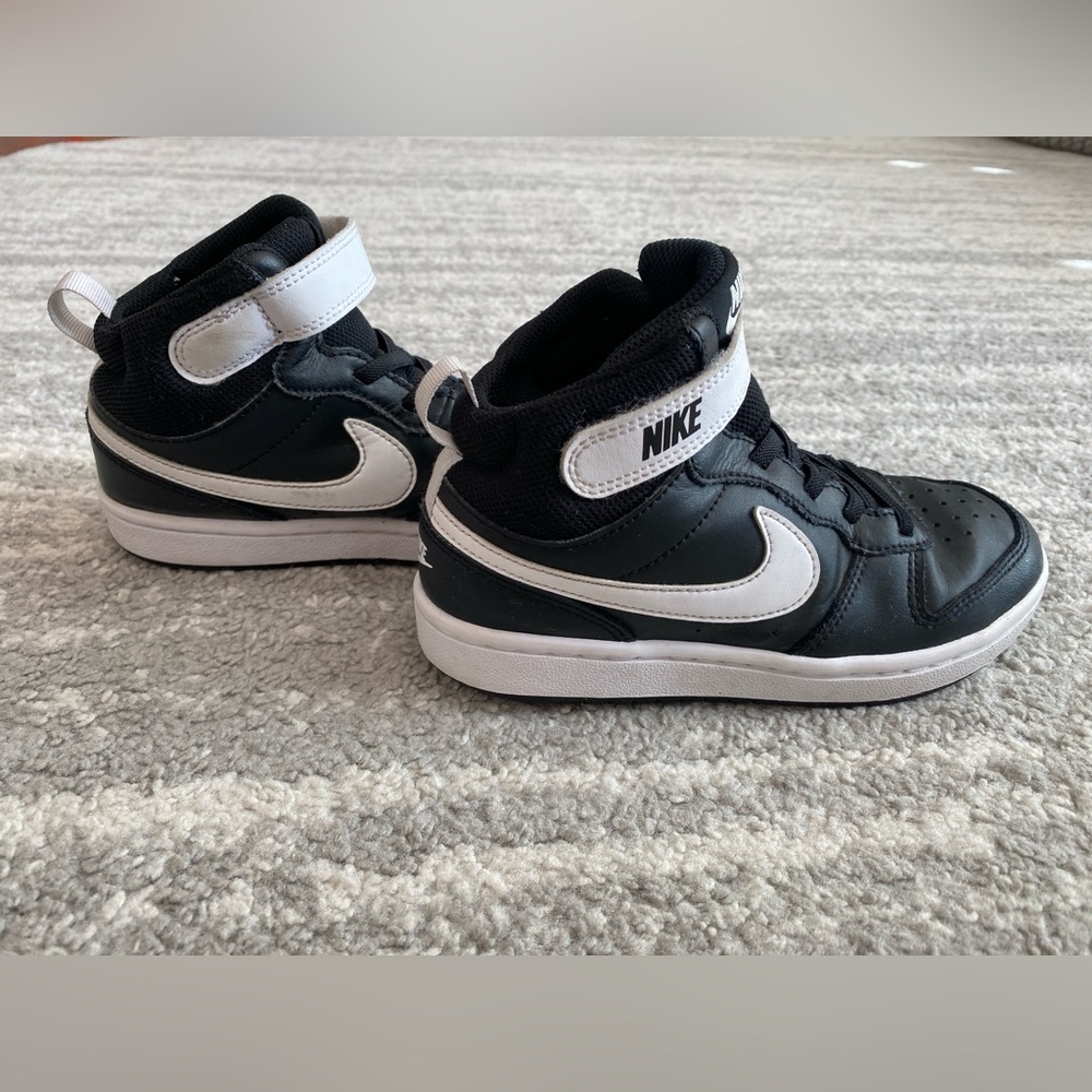 Nike boy black and white basketball high tops, size 1